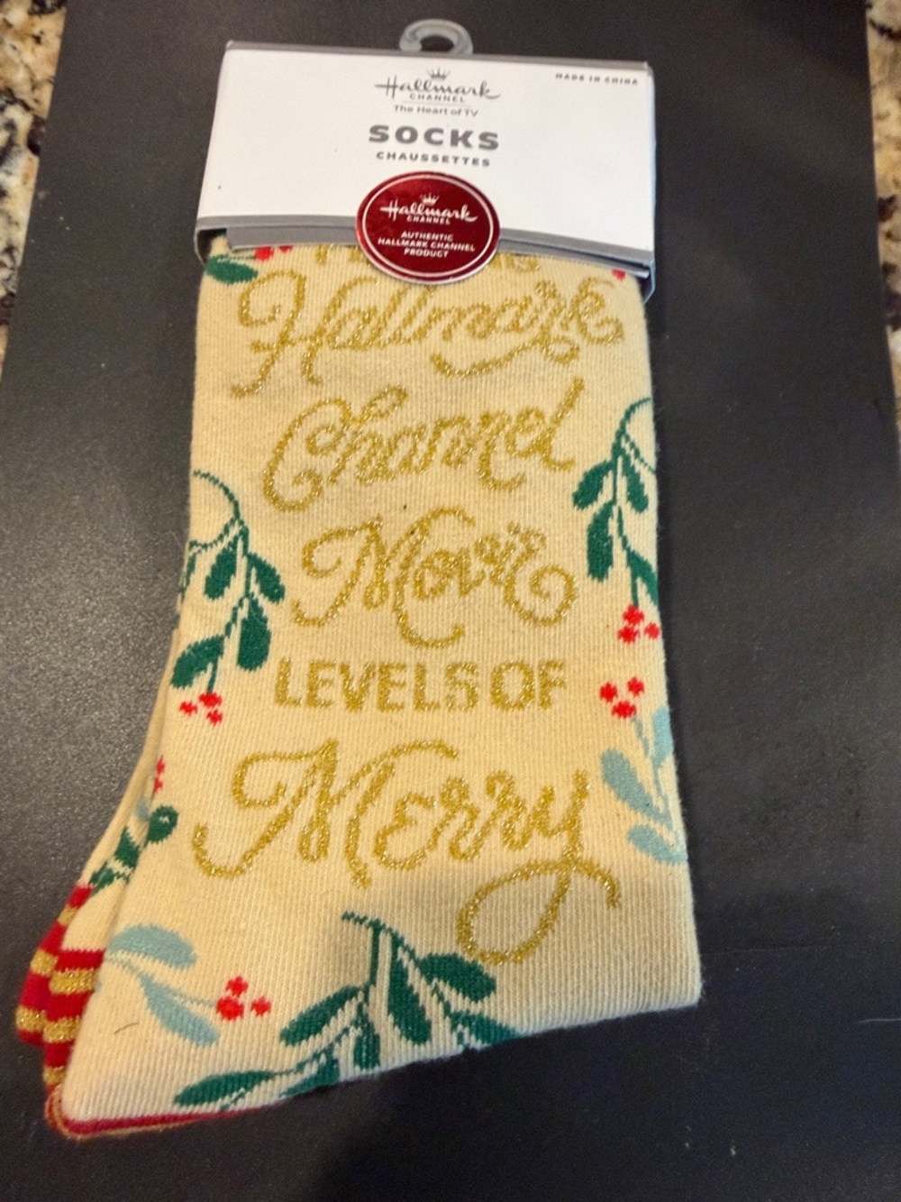 Hallmark cream holiday socks with green and red accents